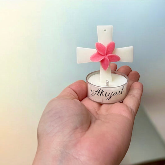 Cross in candle holder