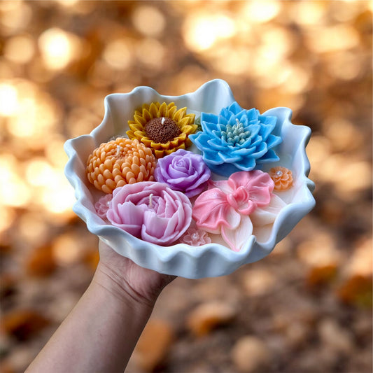 Vela de flores en envase irregular