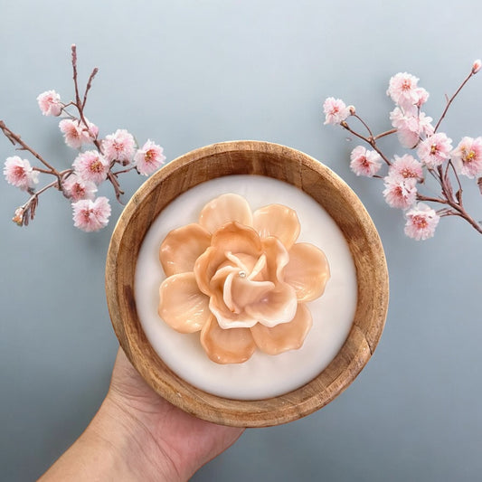 Flowers in a small round wooden bowl